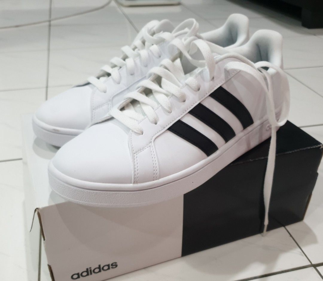 Adidas white shoes with black stripes clearance on one side