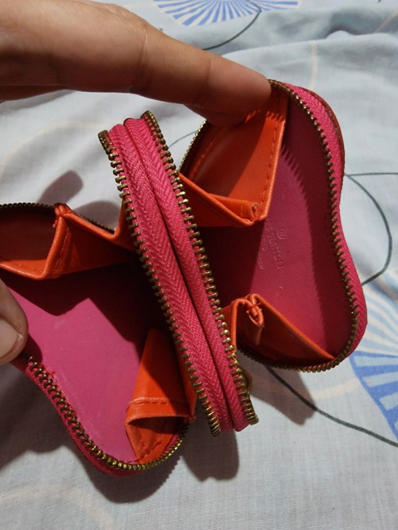 Heart wallet (Category: Luxury Bags & Wallets) located in Cebu City. Submitted by rhea20ph (Listing ID 1199598581, Image 3). Description: pre loved item patent material 2 compartments no code flaw: minimal color transfer plus sf.