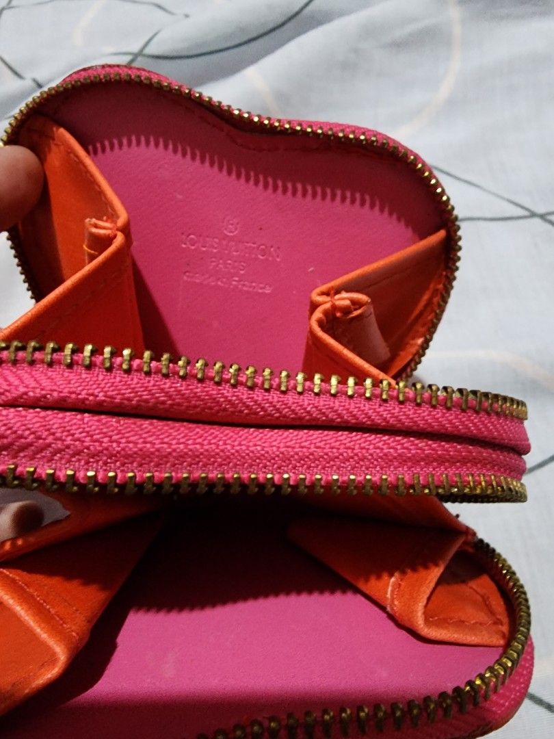 Heart wallet (Category: Luxury Bags & Wallets) located in Cebu City. Submitted by rhea20ph (Listing ID 1199598581, Image 2). Description: pre loved item patent material 2 compartments no code flaw: minimal color transfer plus sf.