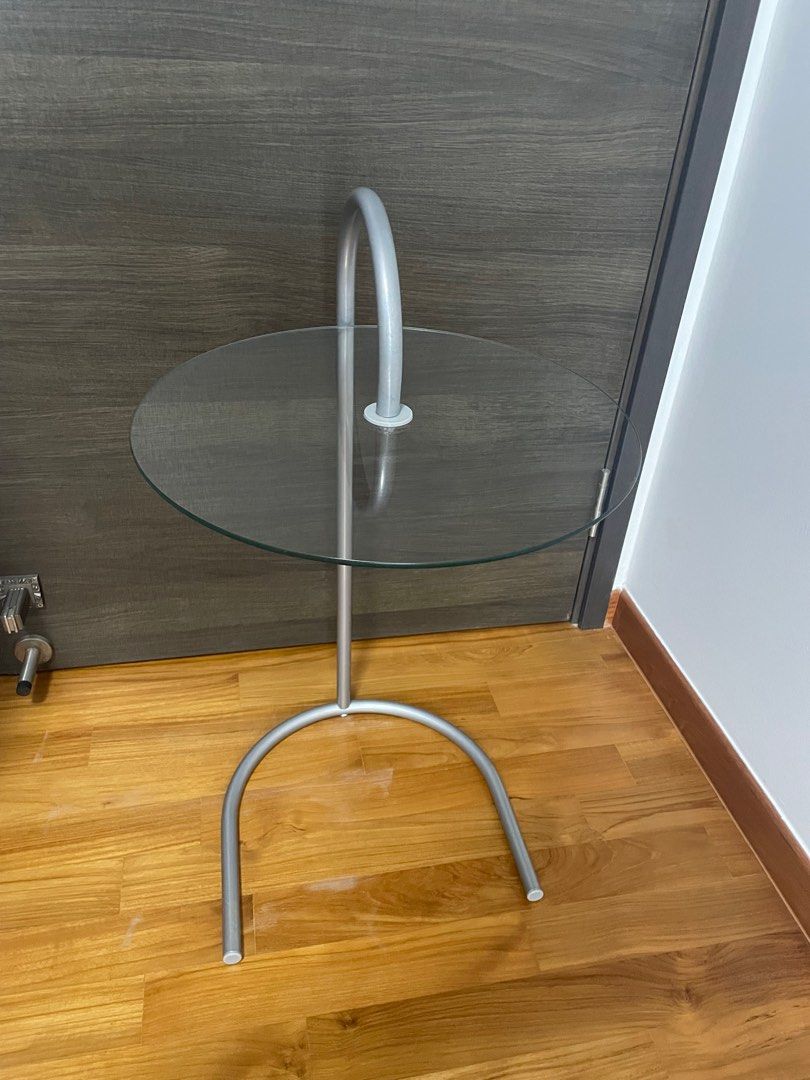 Side table (Category: Other Home Furniture) located in Singapore. Submitted by foiegras18 (Listing ID 1199537955, Image 2). Description: Side table in good condition. Diameter of glass : 40cm Height (floor to glass) : 57cm Height (floor to top handle) : 68cm Base : 34.5cm x 34.5cm Self collection .