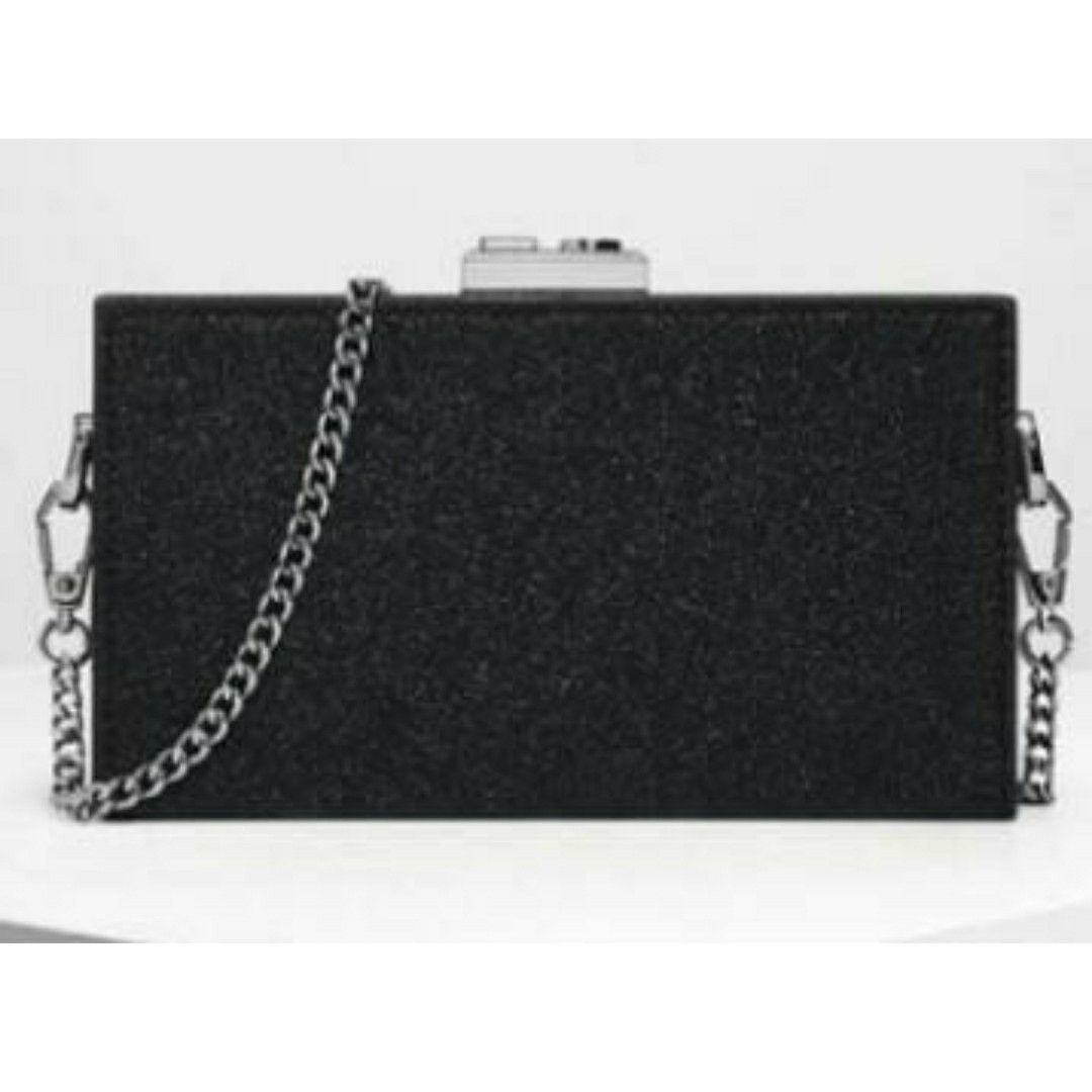 Charles & Keith Clutch Black Glitter Boxy Branded Luxury Hand Bag Sling Shoulder Cross Body Women Purse (Category: Bags & Wallets) located in Singapore. Submitted by starryyskiess (Listing ID 1199767636, Image 1). Description: Used a few times, a bit worn (see last 2 pics) Meetups preferred!! Usual price: around $60.