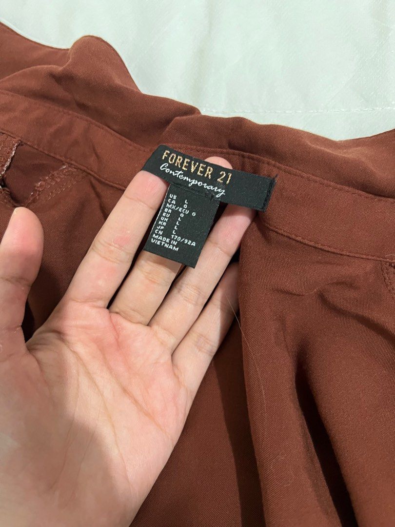 Forever 21 Brown Polo (Category: Blouses) located in Manila. Submitted by jbsquared (Listing ID 1199720096, Image 3). Description: Condition: 10/10, barely worn Bought in Forever 21 Dubai, size large indicated but I think it’s petite sizing or it’s more like a medium for me ☺️ RFS: decluttering Location: pasig.