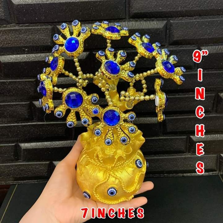 Evil eye with blue money pao tree (Category: Other Home Decor) located in Manila. Submitted by delynonlineshopping_ (Listing ID 1199948442, Image 2). Description: 💥 NEW ARRIVAL POST 💞 EVIL EYE W/ BLUE SWAROVSKI MONEY PAO TREE DECOR CHARM 💞 🧿 EVIL EYE - The Evil Eye is a very powerful, traditional protective symbol used in Feng Shui against harmful energy. It can be used for personal protection, for babies, animals, outside or inside the house