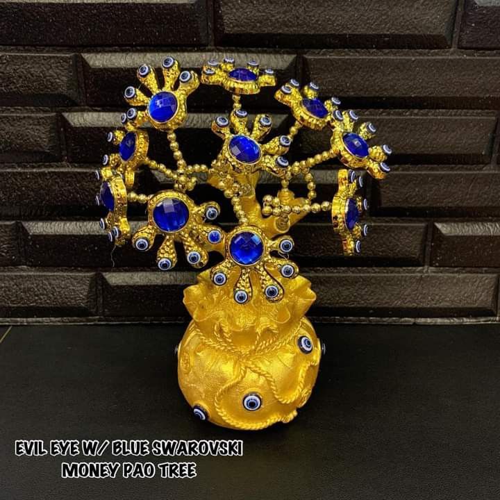 Evil eye with blue money pao tree (Category: Other Home Decor) located in Manila. Submitted by delynonlineshopping_ (Listing ID 1199948442, Image 1). Description: 💥 NEW ARRIVAL POST 💞 EVIL EYE W/ BLUE SWAROVSKI MONEY PAO TREE DECOR CHARM 💞 🧿 EVIL EYE - The Evil Eye is a very powerful, traditional protective symbol used in Feng Shui against harmful energy. It can be used for personal protection, for babies, animals, outside or inside the house