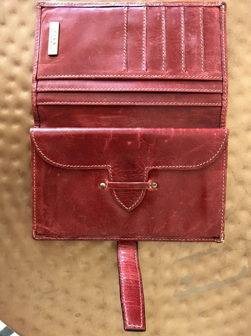 Fino Leatherware Wallet (Category: Wallets & Card holders) located in Taguig. Submitted by thrift4paws (Listing ID 1199848938, Image 2). Description: original fino wallet in red/orange combination..