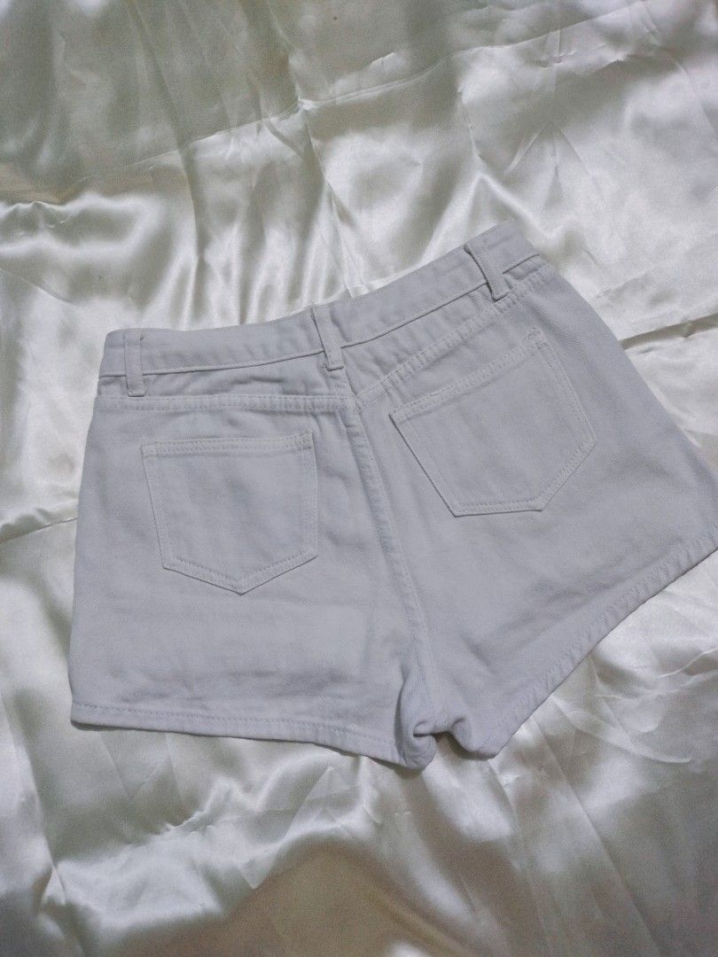 White tattered shorts (Category: Shorts) located in Santa Rosa. Submitted by jaypi.declutter (Listing ID 1199984126, Image 2). Description: waist: 28 inches rise: 11.5 inches with small faint stain near the hem For more information, please send me a message..