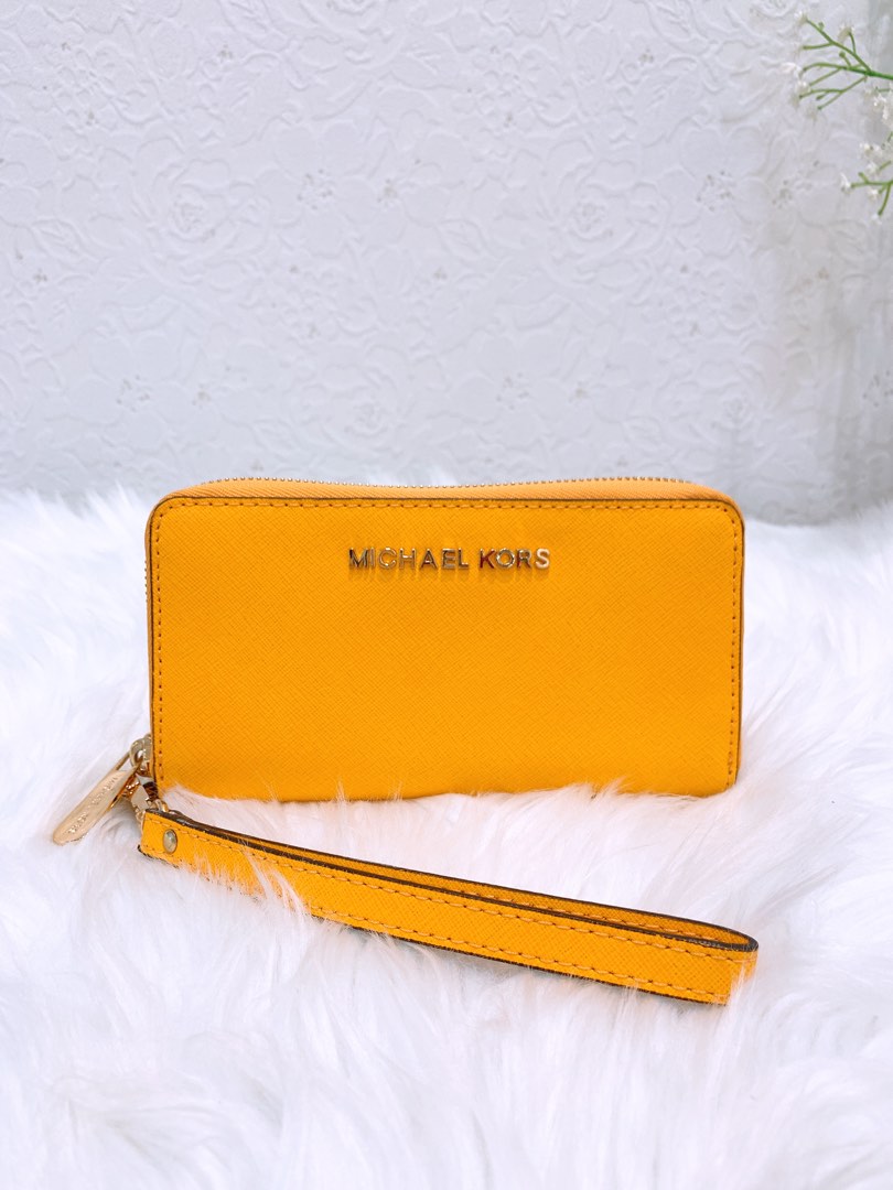 Michael Kors zip around Long wallet in yellow, Luxury, Bags & Wallets on  Carousell