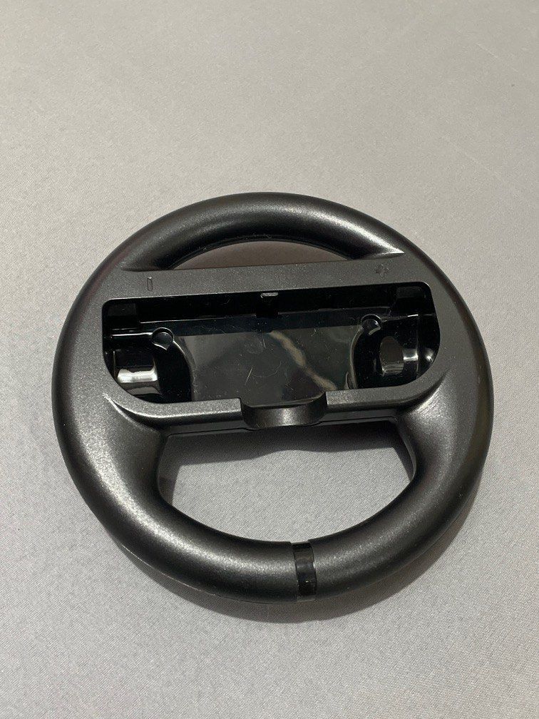 Nintendo Switch Joy-Con Wheels (Category: Controllers) located in Las Pinas. Submitted by meep_morp_z (Listing ID 1194421757, Image 2). Description: accessories for your joy-con switch! for mario kart fun and games.