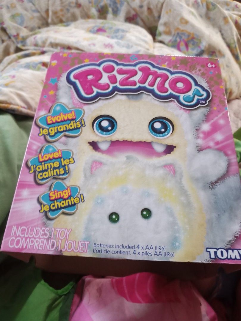RIZMO EVOLVE TOYS, available color: pink and white (Category: Interactive Toys) located in Pasig City. Submitted by candy_boxess (Listing ID 1194496225, Image 2). Description: Rizmo is an interactive pet toy released by Takara Tomy that evolves through sound. Rizmo has come from the far side of the galaxy to play with you! Sing and dance with RIzmo to help it evolve! Rizmo may have fallen asleep on its journey to Earth but, once you take it from 