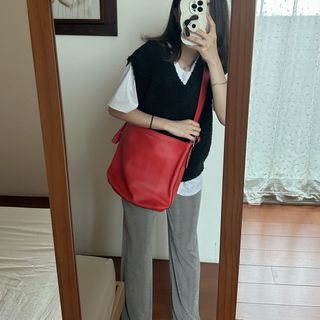 狀況良好！Coach橘紅水桶包