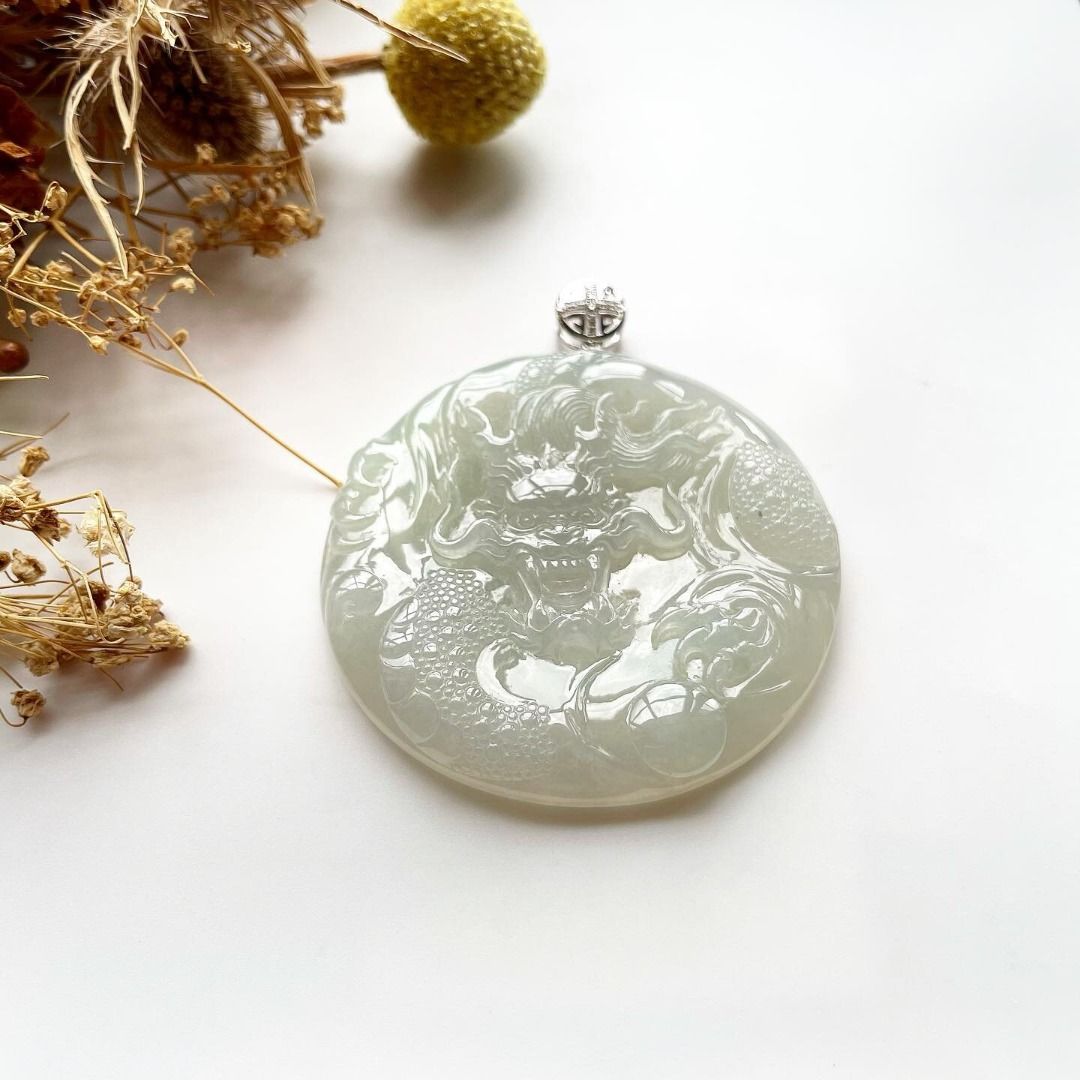 Carved jade hotsell dragon pendant
