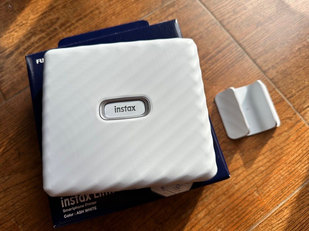 Fujifilm Instax Link Wide Smartphone Printer (Category: Camera Bags & Carriers) located in Quezon City. Submitted by lovedbymaris (Listing ID 1194626962, Image 2). Description: Brand new actually kadedeliver lang kanina (Nov 4, 2022) just tested it printed 4 pictures very nice and easy to use neto no issue, no flaws, no damage! Color: Ash Gray RFS: Bought a Canon printer instead for Photo Album kasi i like printed not polaroid copy .