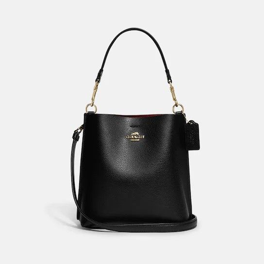 🇺🇲Authentic Coach Mollie Bucket Bag 22 (Category: Luxury Bags & Wallets) located in Santa Cruz. Submitted by janelovebagswatchesshoesph (Listing ID 1194776795, Image 1). Description: Product Details Introducing Mollie, an updated version of our Town Bucket Bag Double face leather Center zip compartment Snap closure Detachable handle with 6 3/4" drop Detachable strap with 22" drop for shoulder or crossbody wear 8" (L) x 8 1/2" (H) x 4" (W) Style