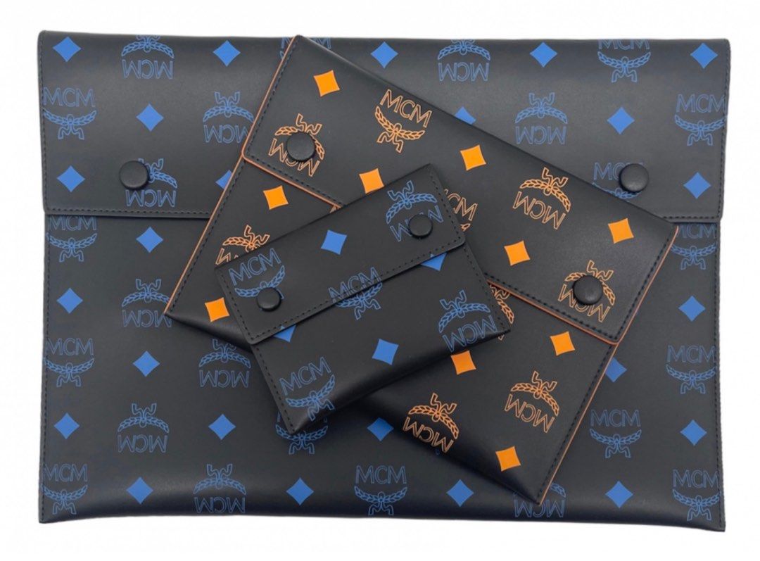 (PRICE REDUCTION) Authentic MCM Trio Pouch (Category: Luxury Bags & Wallets) located in Cebu City. Submitted by tala10 (Listing ID 1194954074, Image 3). Description: Further price reduction: 25k for the set SUPER SALE: 27.5k FURTHER REDUCTION: 30k SALE: 32k from 33.5k REPRICED from 35k to 33.5k This is a 3-piece set of pouches from MCM, similar to LV’s kirigami set. The large and small come in blue monogram while the medium is in orange monogram,
