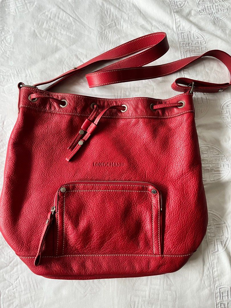 Longchamp Red Bucket Bag (Category: Luxury Bags & Wallets) located in Manila. Submitted by camillevanille (Listing ID 1194811114, Image 1). Description: Bought in Singapore Authentic .