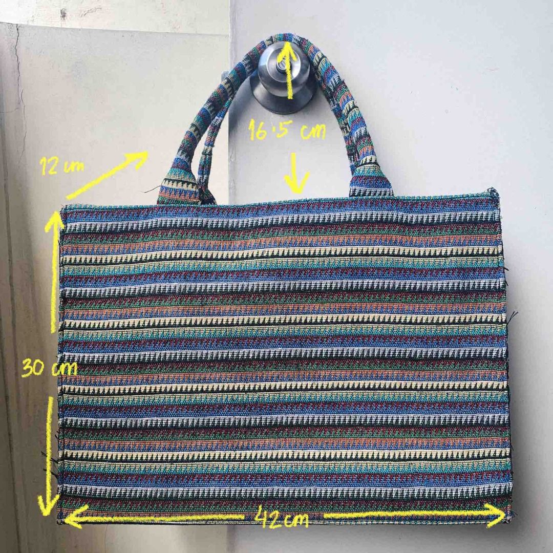 Kultura Tote/Shoulder Bag (Category: Tote Bags) located in Balanga. Submitted by mauseu (Listing ID 1194971985, Image 2). Description: Dimensions [H×W×D] : - 30×42×12 cm (11.8×16.5×4.74 inches) - Handle drop: 16.5 cm (6.5 inches) The bag is stiff/structured, so it can stand on its own. It has woven detailing and fabric lining inside. The closure is a magnetic button and there is a small pocket inside. It can comfortably fit: - 22oz Aquaflask bott