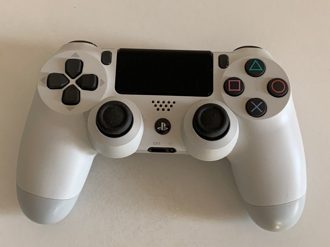 PS4 Controller (Category: Controllers) located in Singapore. Submitted by lee.weisong.7 (Listing ID 1194960798, Image 2). Description: 9.9/10 condition. White in colour. Only without the charging cable. For PS4. .