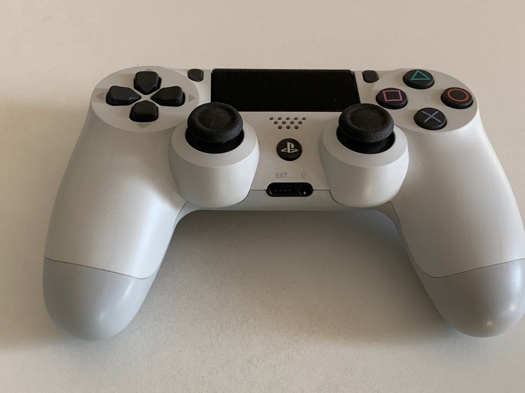 PS4 Controller (Category: Controllers) located in Singapore. Submitted by lee.weisong.7 (Listing ID 1194960798, Image 1). Description: 9.9/10 condition. White in colour. Only without the charging cable. For PS4. .
