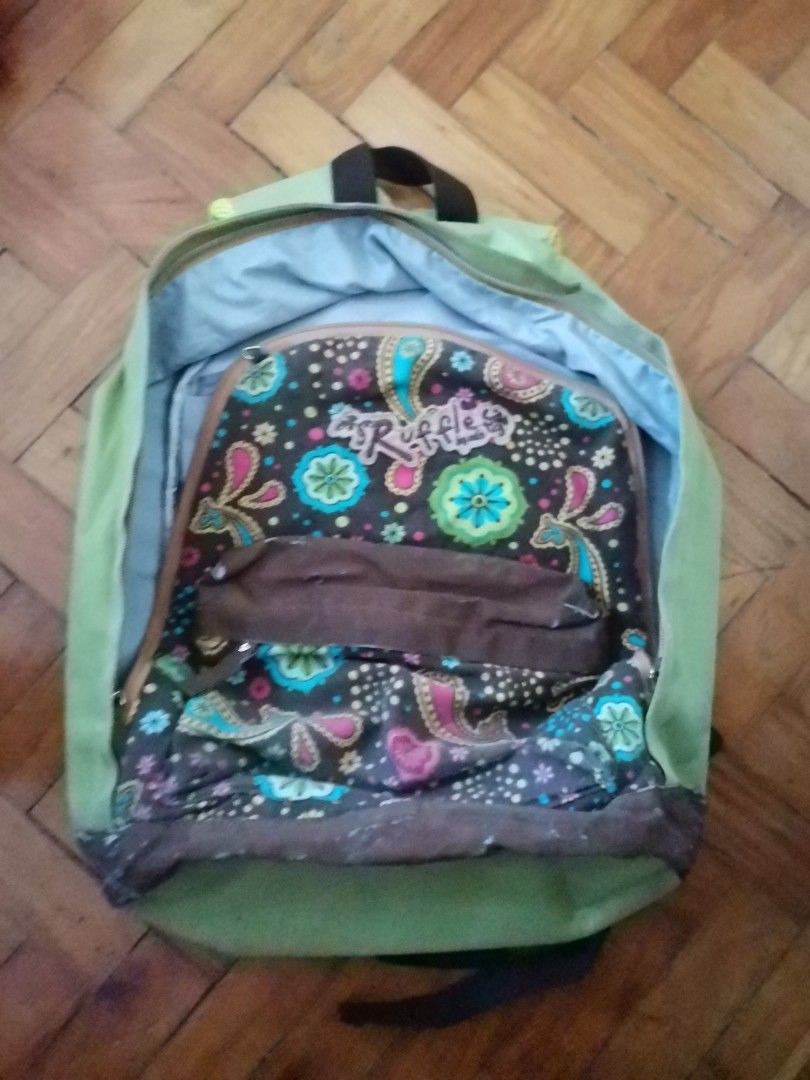 Ruffles Backpack (Category: Backpacks) located in Quezon City. Submitted by fluffymoose0424 (Listing ID 1195036947, Image 1). Description: Ruffles Backpack Green with front floral designs Decent shoulder support RFS: Decluttering Flaws: no visible tears but needs washing (from attic).