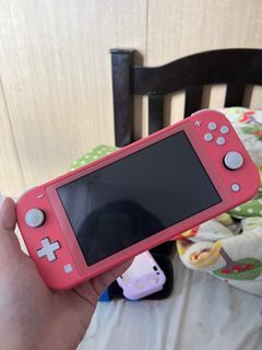 Switch Lite Coral with physical games