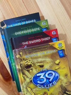 The 39 Clues (Books 1-4) with free card pack