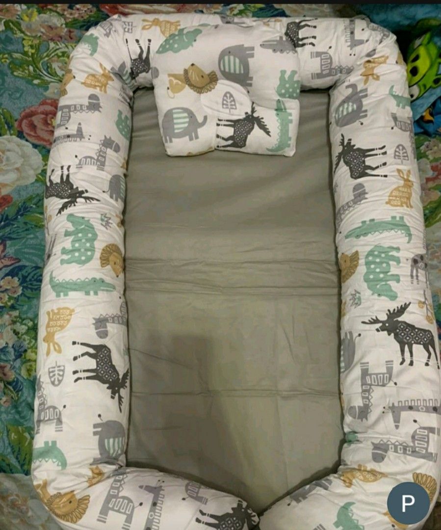 Baby Crib nest with pillow (Category: Cots & Cribs) located in Marilao. Submitted by majoriety (Listing ID 1191253396, Image 3). Description: di po nagamit yun pillow & bed blanket (used) animal print 80×50cm kakabili lng, mas gusto ni baby sa duyan gcash shapee chec k out https://shope.ee/408NYanEpt.