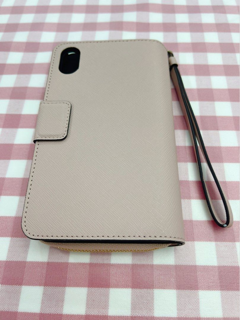 Kate Spade Iphone XR case (Category: Purses & Pouches) located in Singapore. Submitted by instinctivezz (Listing ID 1195312597, Image 2). Description: Brand new, authentic. A very sweet nude pink. Kept till forgotten and already changed phone. Since this is old model open to nego or offer. .