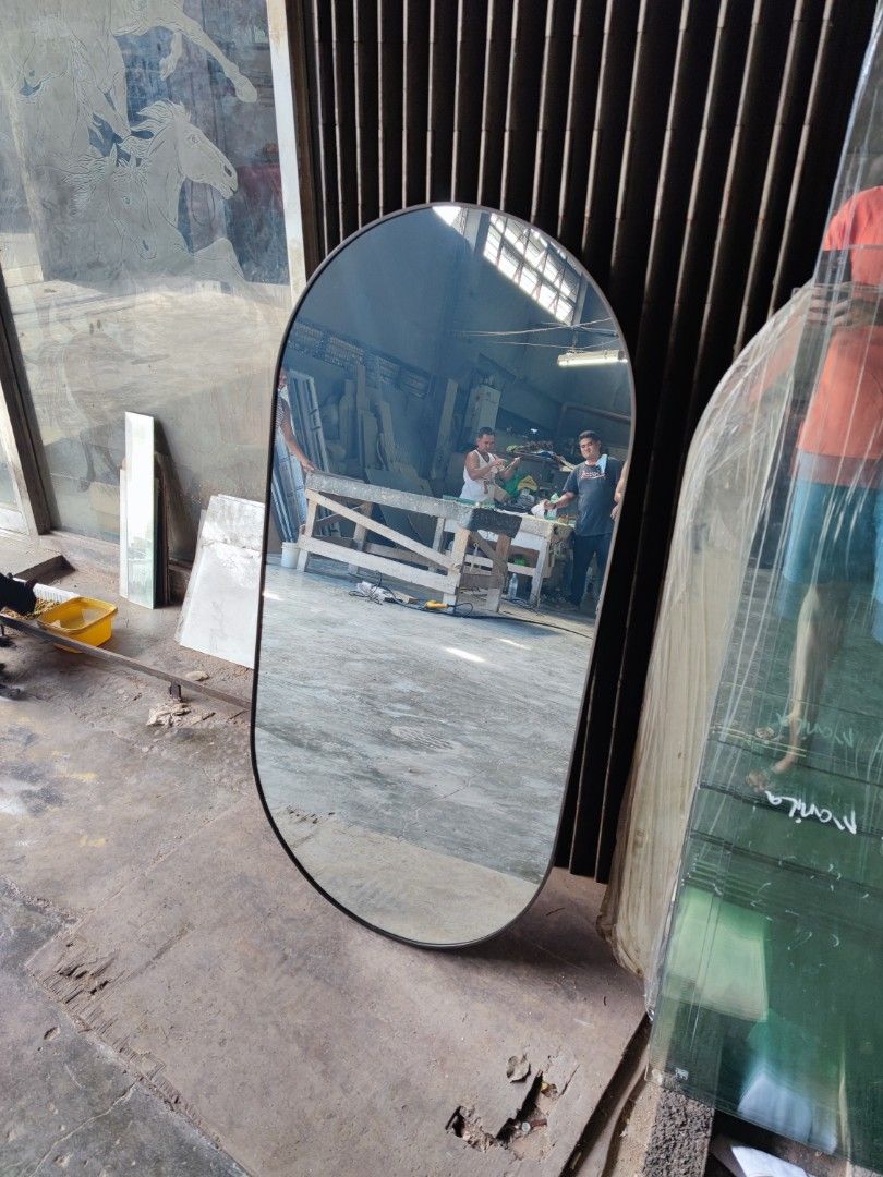 Oval Mirror with frame (Category: Mirrors) located in Malabon City. Submitted by mirrors.ph (Listing ID 1195222583, Image 2). Description: Oval mirror with black aluminum frame and plywood backing. Using 6mm thick copper free lead free mirror. Size: 2ft x 4ft P2160 Add P200 if with back hook. Available colors gold, glossy black, matte black, white and silver aluminum frame. Customize sizes and shapes are welcome..