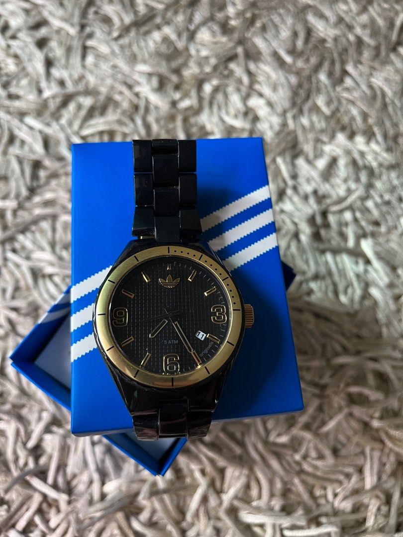 Adidas black 2025 and gold watch