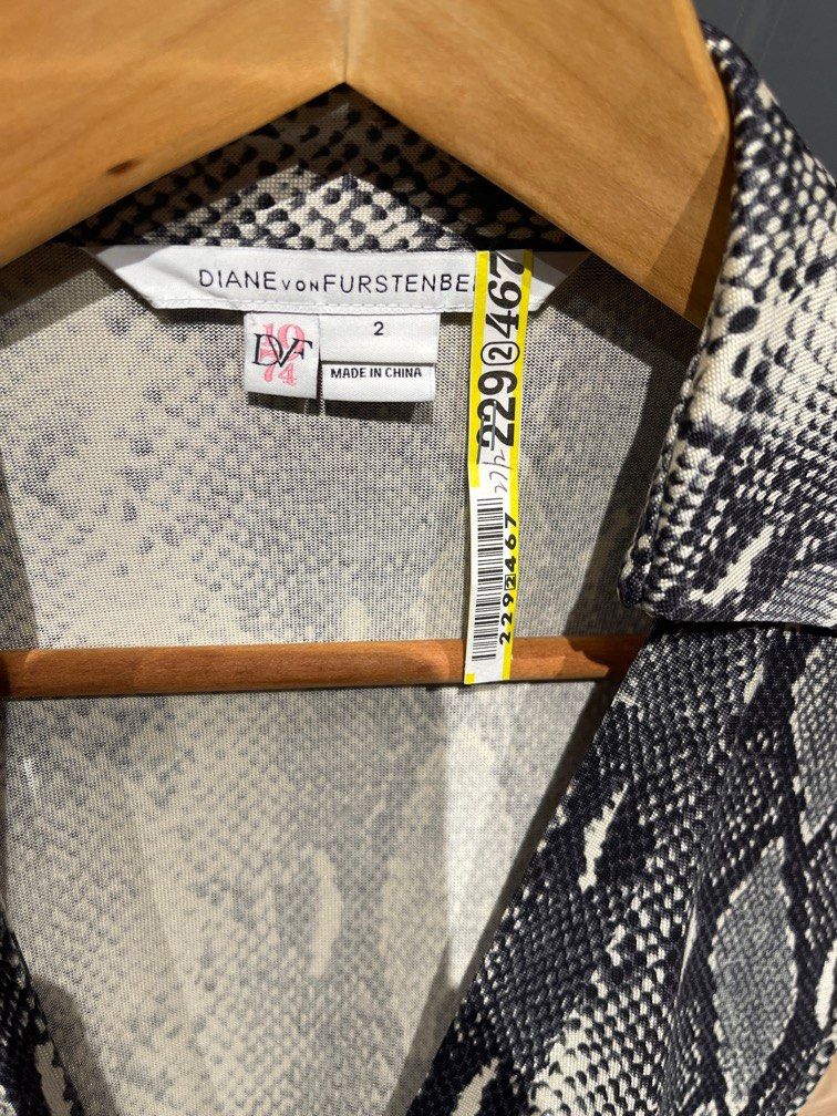 DVF Python Print Dress (Category: Dresses) located in Singapore. Submitted by LE_PreAime (Listing ID 1200330941, Image 3). Description: Diane Von Furstenberg signature jersey wrap dress in python print. DVF sizing for size 2: 86-66-91 Serious buyers only. No exchange or bargaining. Price inclusive of postage within Singapore..