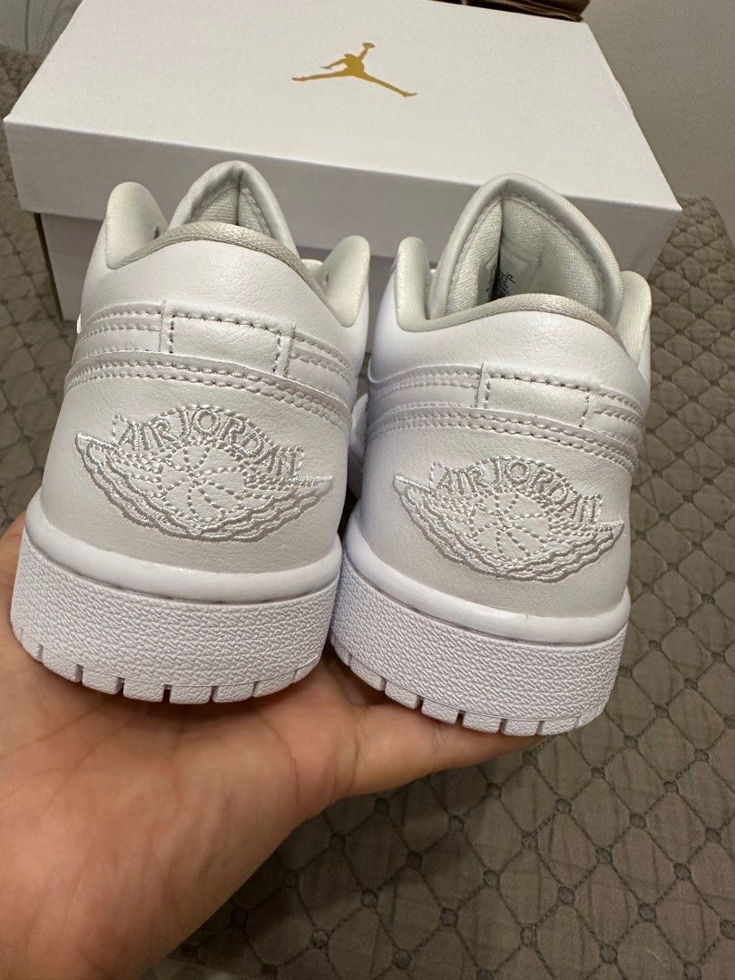 Jordan 1 Low Triple White 7.5W (Category: Sneakers) located in Marikina City. Submitted by totch (Listing ID 1200307046, Image 2). Description: Brand new bought from Nike App. RFS: Wrong size 7.5W.