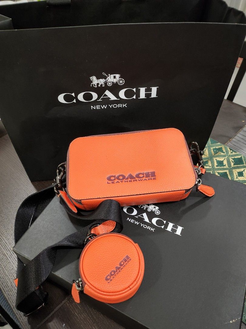 Coach orange sales sling bag