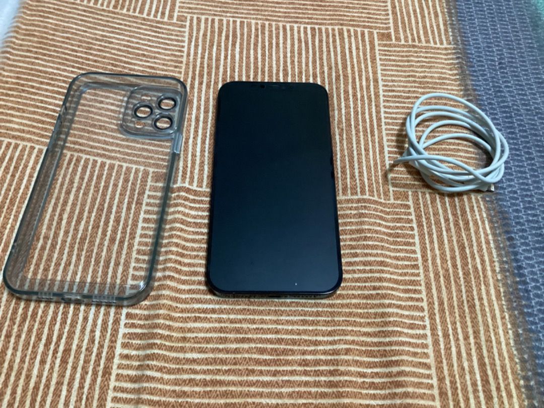 iPhone 12 Pro max (Category: iPhone 12 Series) located in San Juan City. Submitted by michaelarcalas1983 (Listing ID 1202128438, Image 3). Description: 128 GB and 11 months used but receipt were already misplaced. Guaranteed no scratch nor dent. I just changed my phone to iPhone 14 pro max. I can give my 5 almost new casing for free. Package includes mobile phone, 5 casing, cable charger..