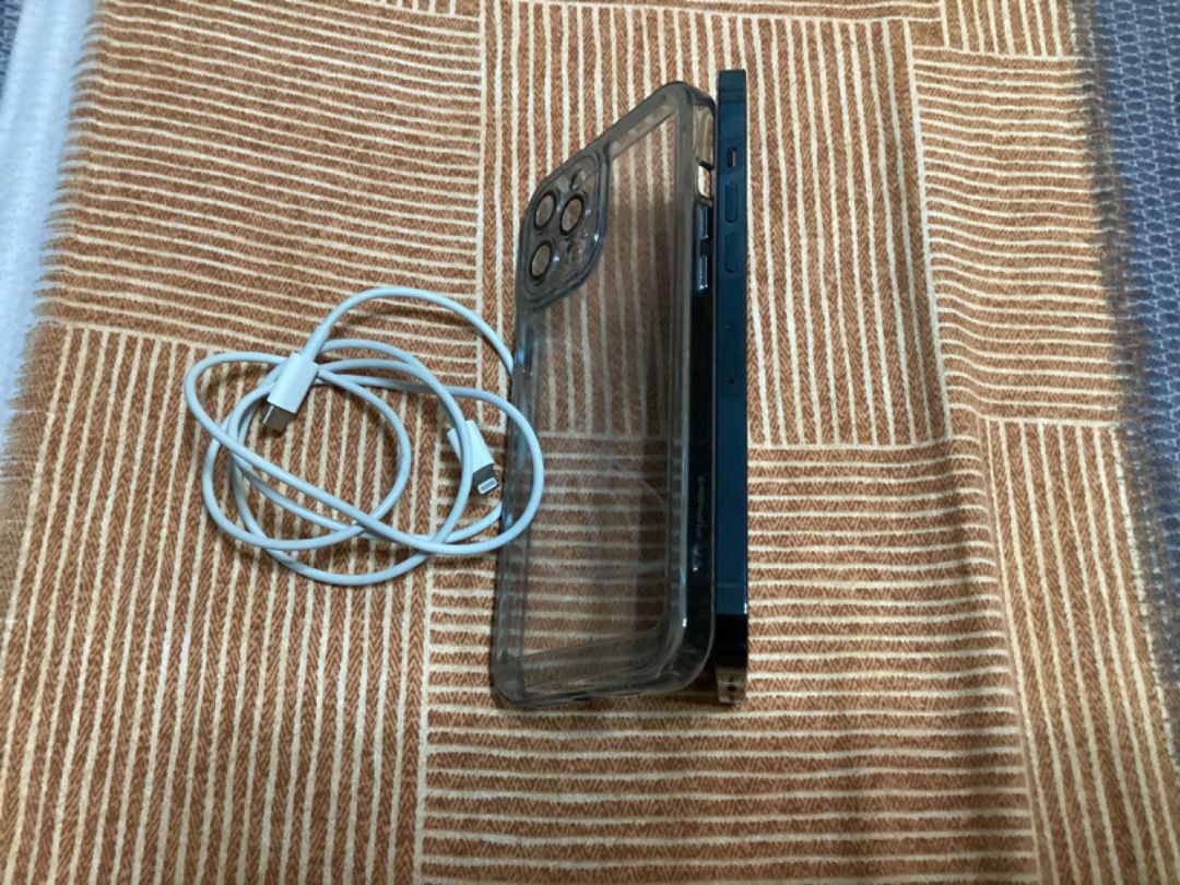 iPhone 12 Pro max (Category: iPhone 12 Series) located in San Juan City. Submitted by michaelarcalas1983 (Listing ID 1202128438, Image 1). Description: 128 GB and 11 months used but receipt were already misplaced. Guaranteed no scratch nor dent. I just changed my phone to iPhone 14 pro max. I can give my 5 almost new casing for free. Package includes mobile phone, 5 casing, cable charger..