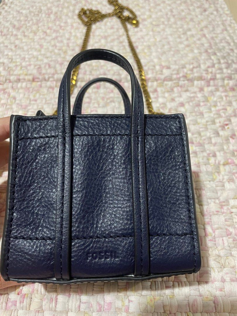 Authentic Fossil Carmen Micro Tote Sling Bag (Category: Luxury Bags & Wallets) located in Manila. Submitted by curatedblingsandbaubles (Listing ID 1202497857, Image 2). Description: Material: Leather Dimensions: 4” L x 2” W x 3.75” H Closure: Zipper Color: Blue Shoulder Drop: 24” Strap: Fixed Chain Crossbody Strap Condition: Almost new (used once) RFS: Too small (does not fit my wallet) Layaway at 0% interest up to 3mos accepted.