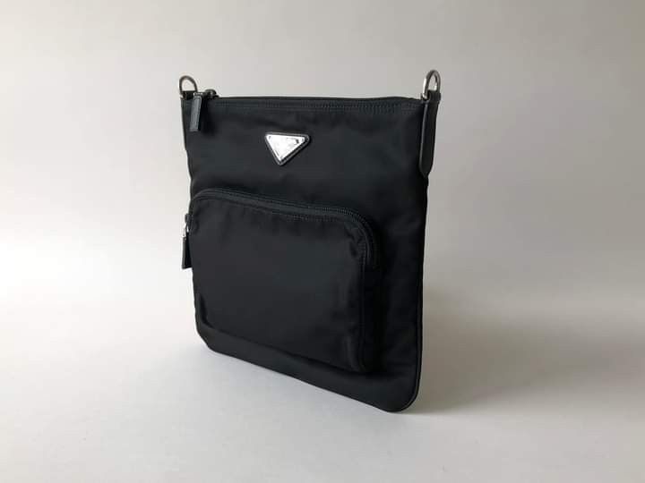 PRADA TESSUTO SAFFIANO SLINGBAG 1BH716 (Category: Luxury Bags & Wallets) located in Manila. Submitted by bagislifeshop (Listing ID 1202844591, Image 3). Description: BRANDNEW PRADA TESSUTO SAFFIANO SLINGBAG 1BH716 Model Number 1BH716 New Edition Front Zip Pocket Black Tessuto Nylon Body Saffiano Leather Details Silver Tone Hardware Dimensions-11.5"x11"x1.5" Adjustable Nylon Strap Comes w/ Tag, Card Dustbag Paperbag & Receipt Copy.