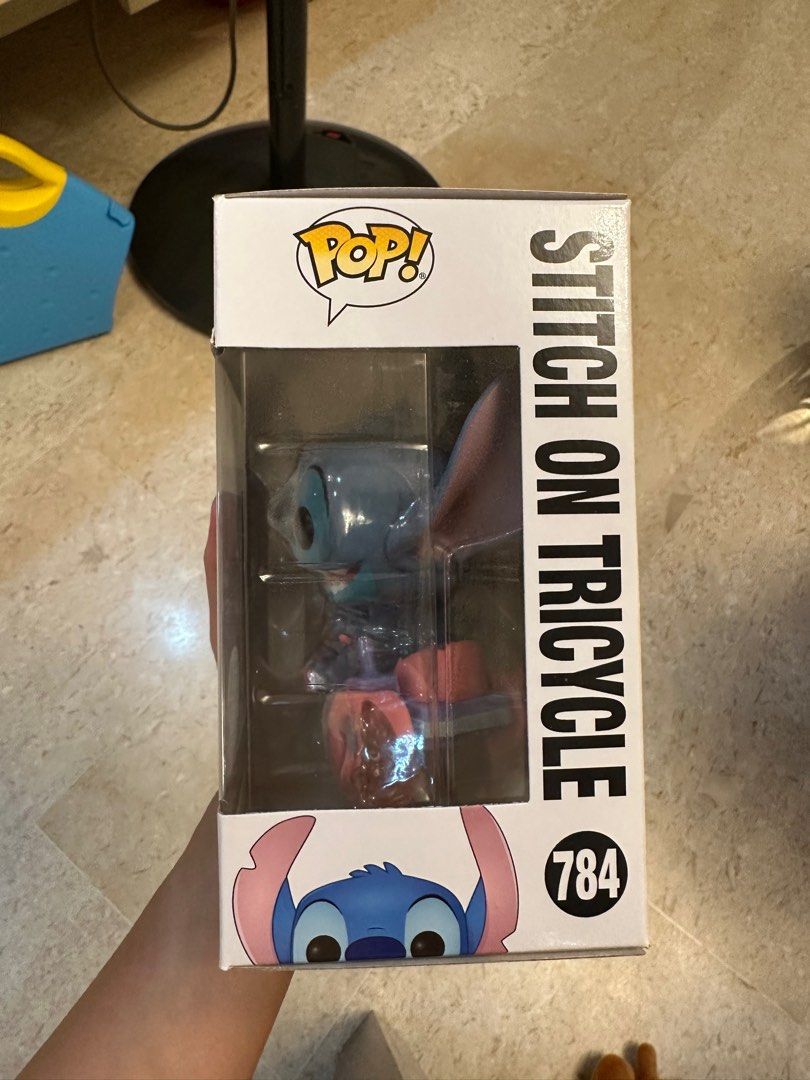 funko pop stitch on tricycle