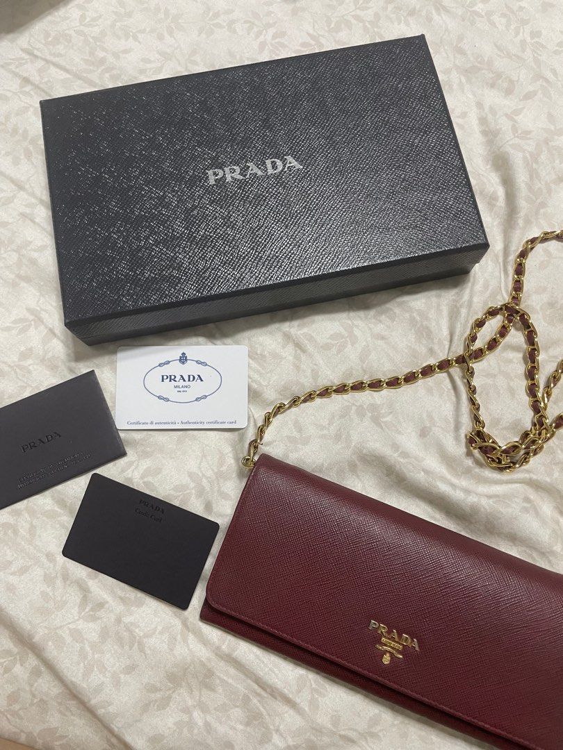 Prada Saffiano Wallet on Chain (Category: Luxury Bags & Wallets) located in Quezon City. Submitted by wardrobebykeith (Listing ID 1203017288, Image 2). Description: Prada Saffiano WOC in Cerise (Maroon) Condition: 7.5/10 Flaw: “P” in Prada is a bit faded but not that apparent Complete with care card and box.