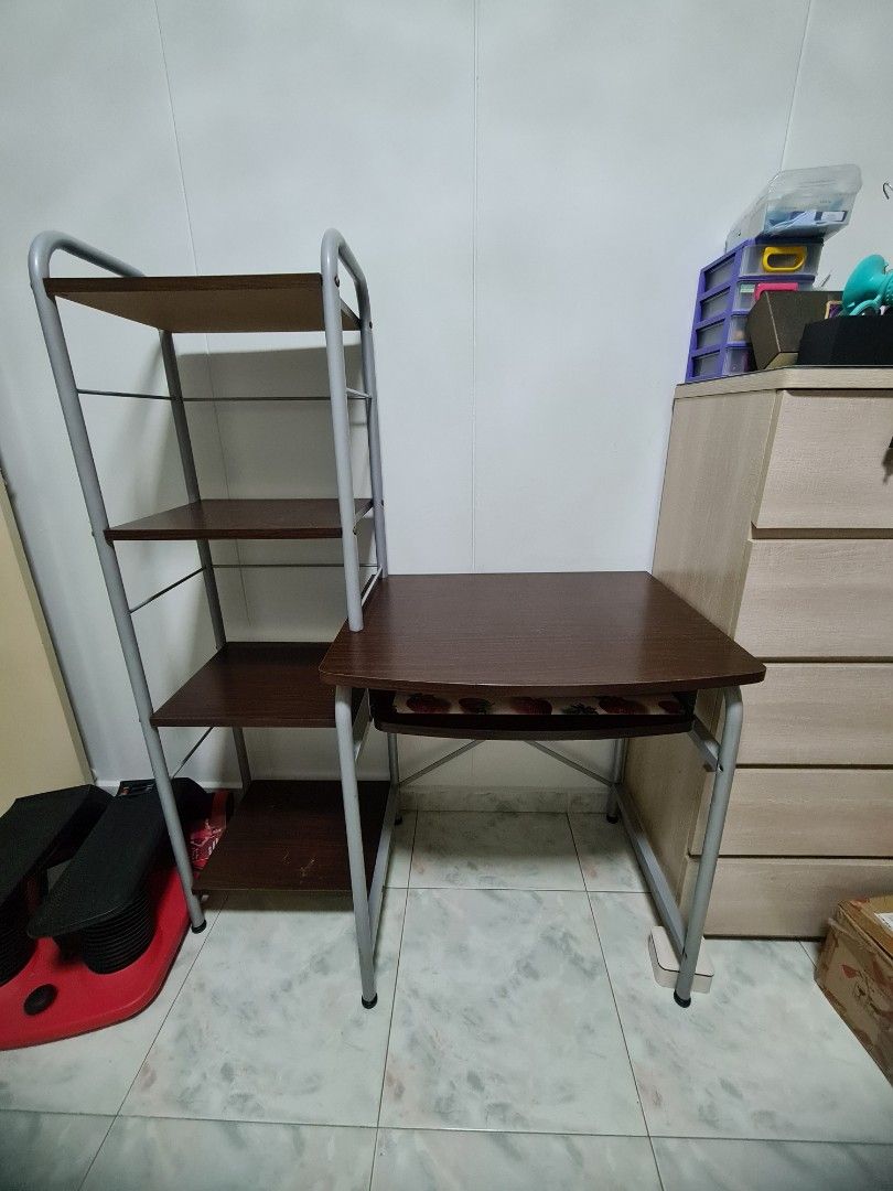 Preloved study table (Category: Other Home Furniture) located in Singapore. Submitted by theqian (Listing ID 1203013967, Image 1). Description: Study table that's perfectly functional. only screws look rusty due to long period of use. collection at 670447.