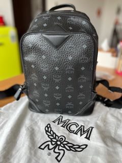 Authentic Brand New MCM Backpack with Dog plush, Women's Fashion, Bags &  Wallets, Backpacks on Carousell