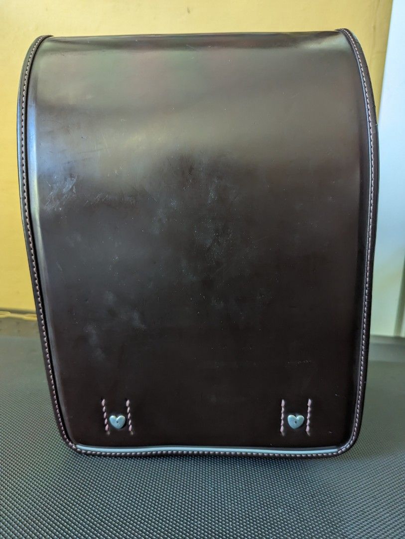 Randoseru for girls (Category: Backpacks) located in Binan City. Submitted by silvercrystal.a0d726 (Listing ID 1203313261, Image 1). Description: Girl's randoseru. Brown with pink stitching and interior. Made in Japan. 9/10 condition. With minor flaw- zipper tab.