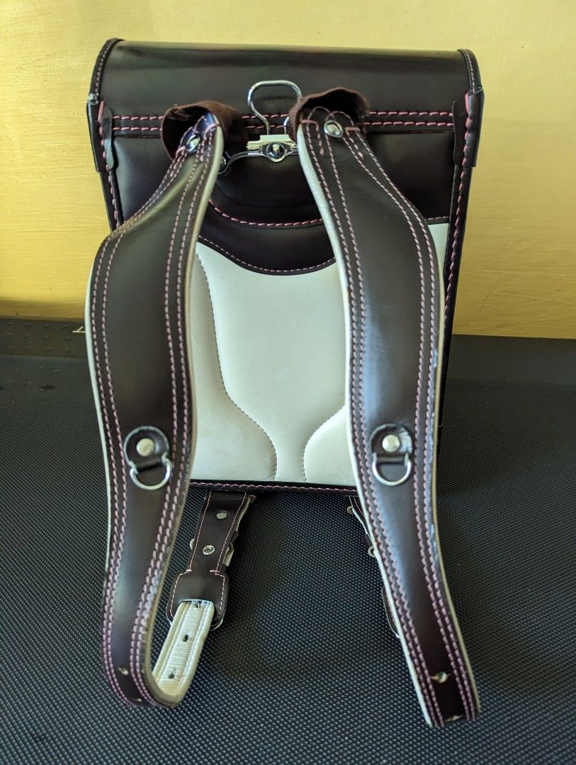 Randoseru for girls (Category: Backpacks) located in Binan City. Submitted by silvercrystal.a0d726 (Listing ID 1203313261, Image 3). Description: Girl's randoseru. Brown with pink stitching and interior. Made in Japan. 9/10 condition. With minor flaw- zipper tab.