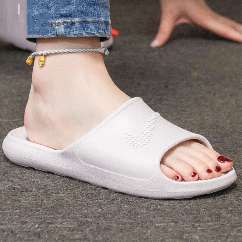 Nike women's shower online slides