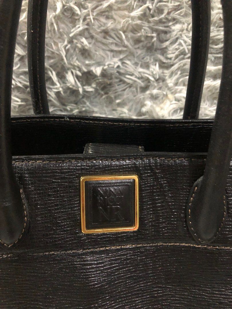 Original Nina Ricci hand bag (Category: Luxury Bags & Wallets) located in Angono. Submitted by fhlor02 (Listing ID 1203735202, Image 2). Description: Original Nina ricci handbag, epi leather material, structured stand alone bag, with slight rubs on d handle at d back part, refer to d last pic uploaded, flaws: inside lining was removed due to stain, again no lining inside, already removed due to stain, last price posted.. very good quality ang lea