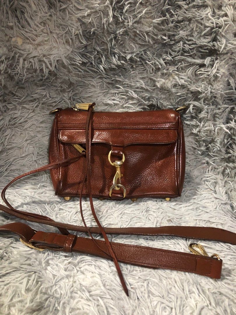 Original RebeccaMinkoff sling bag (Category: Luxury Bags & Wallets) located in Angono. Submitted by fhlor02 (Listing ID 1203737580, Image 1). Description: Original Rebecca minkoff sling bag, replaced sling.. very good leather material, with signature lining and plate inside, dimen:8.5”by6”by1.5”..small size.