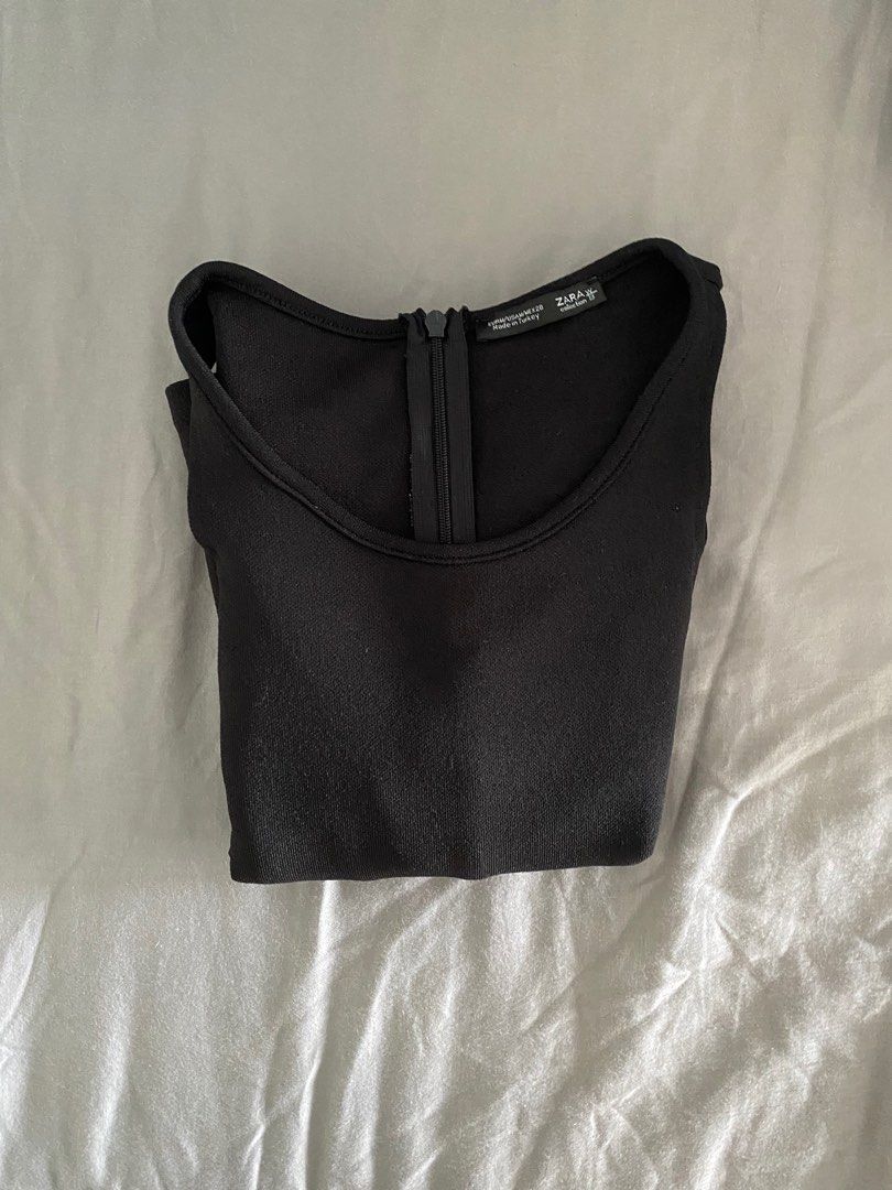 Authentic Zara Black Longsleeve Top with Collarbone Slits (Category: Longsleeves) located in Cebu City. Submitted by ellacece (Listing ID 1203824828, Image 3). Description: Another classic longsleeve from Zara :-) no issues whatsoever with the top. Has a zipper on the side that's in great condition and the condition is a 10/10. The slits at the collarbone make it look unique and really cool 😁 only selling this cause I have wider shoulders and it