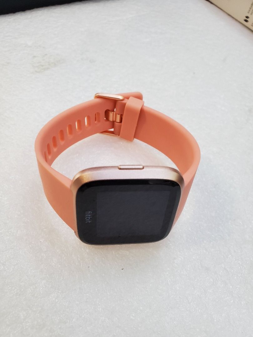 Fitbit versa top watch peach