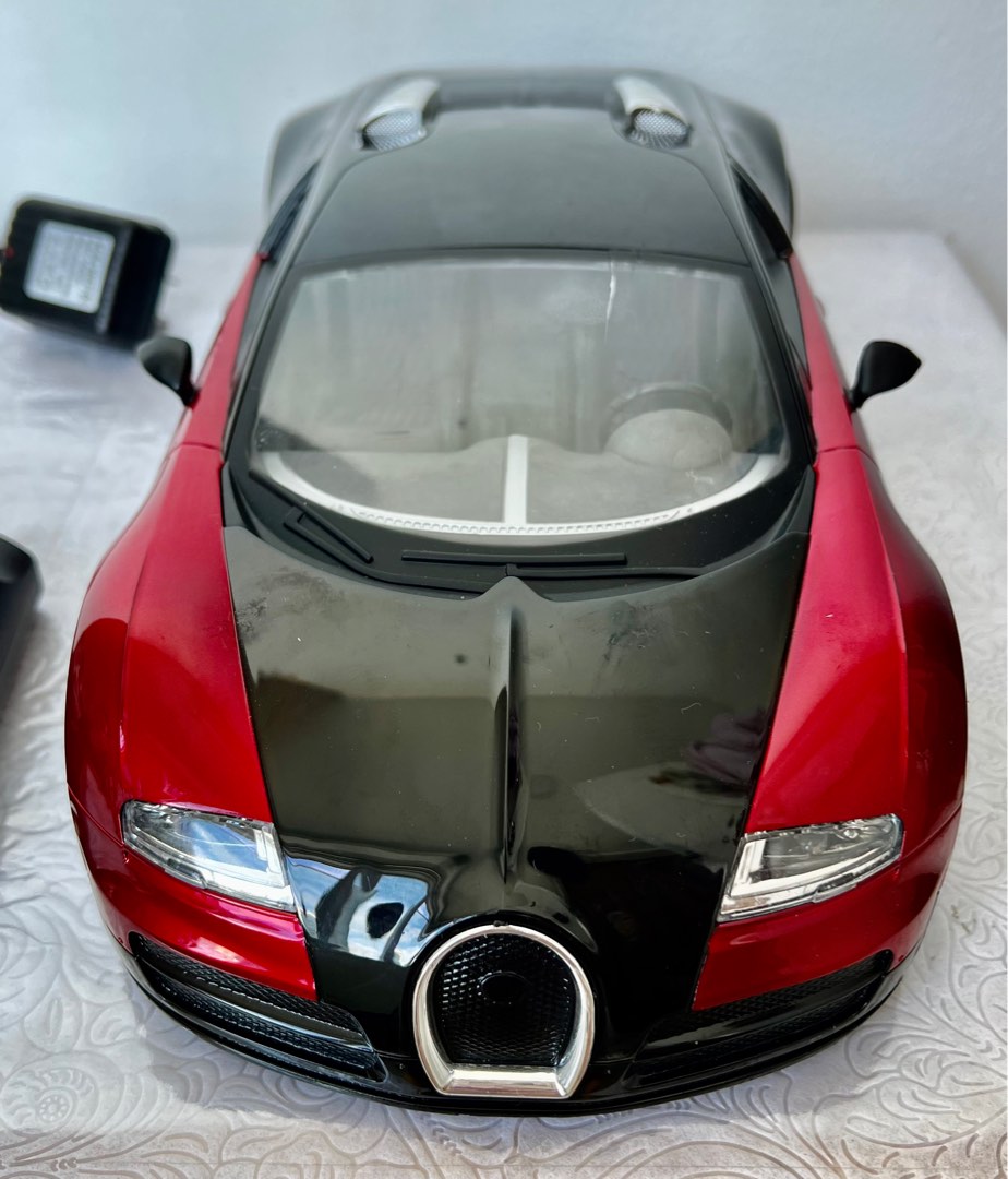 Red remote control car with rechargeable batteries, Hobbies & Toys