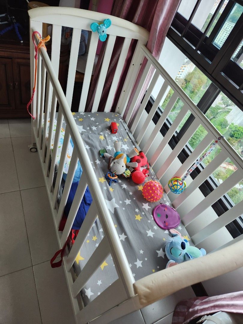White baby cot with wheels and gate, Babies & Kids, Baby Nursery & Kids