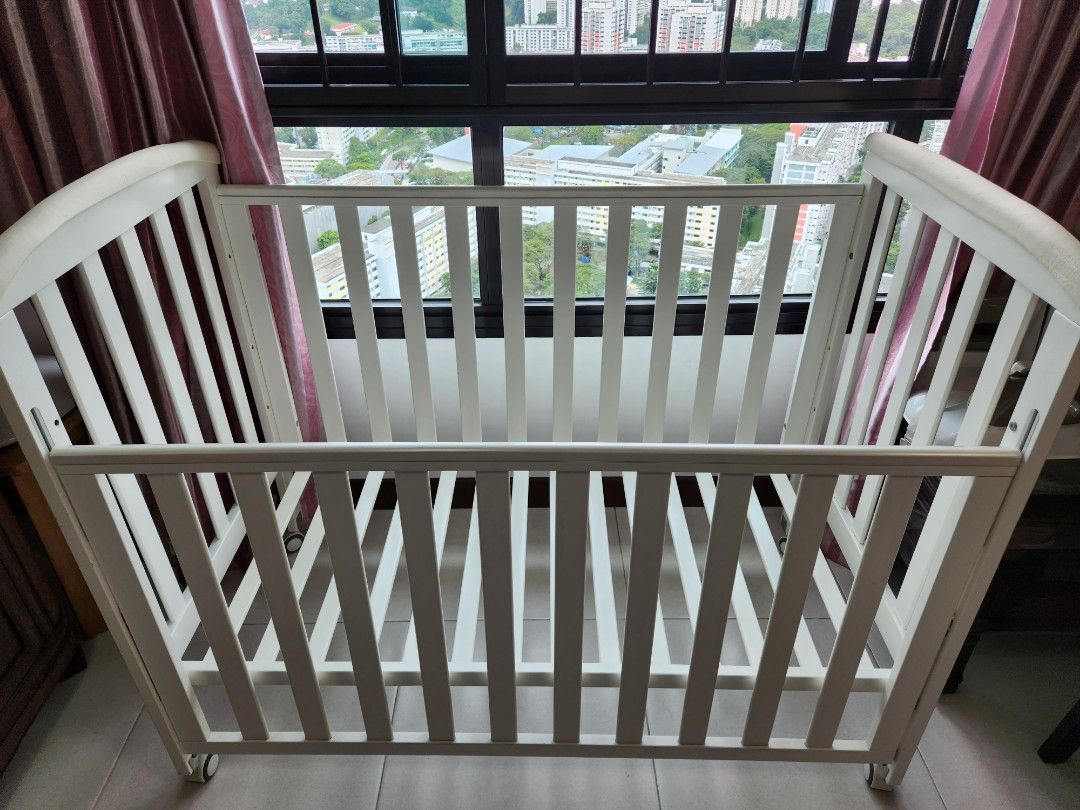 White baby cot with wheels and gate, Babies & Kids, Baby Nursery & Kids